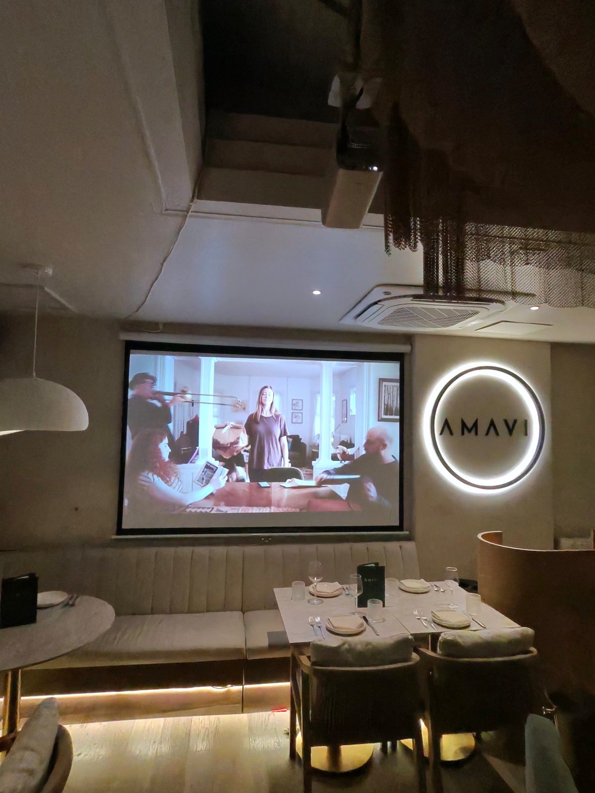 Projector screen in a lounge setting